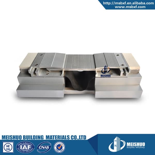 Symmetrical metallic expansion joint systems for heavy duty
